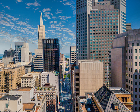 Aerial view between skyscrapers in San Francisco's Financial district. Looking down Sansome Street towards the Bay on a sunndy day.