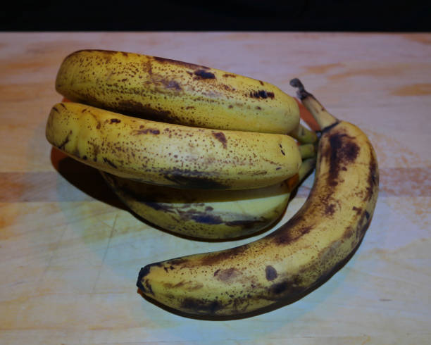 istock Ripe Banana on Cutting Board 1222503584