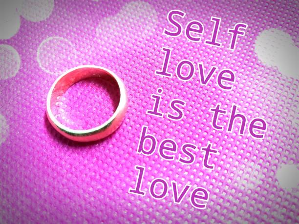 Golden ring on pink background with quote
