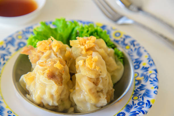Traditional Chinese Korean DimSum, fresh Dumplings  with souce on table