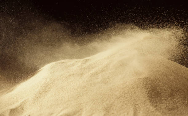 istock Gold sand splash against on dark background. 1222519668
