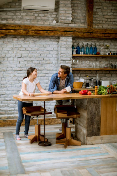 istock Young father and his cute daughter making dough at home kitchen 1222520683