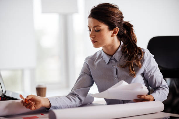 istock Young woman working on a project stock photo 1222521721