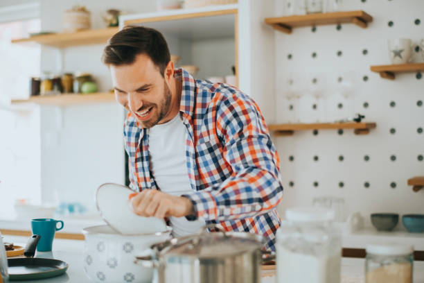 istock Smiling young man in kitchen stock photo 1222522669