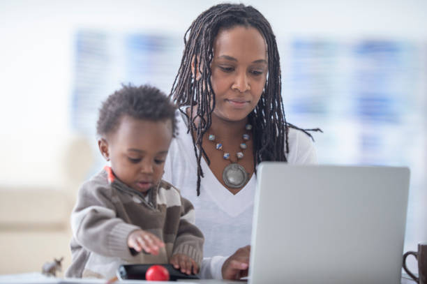 istock Mother and young son working from home 1222522896