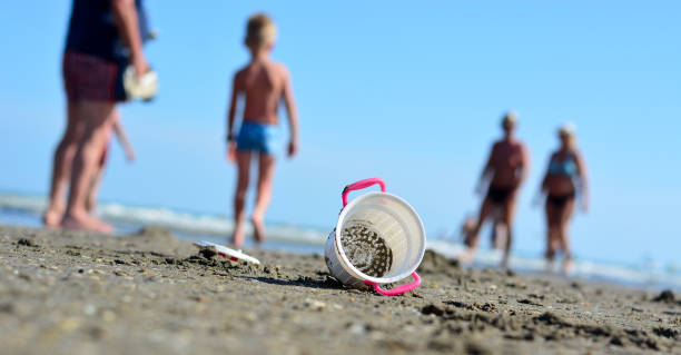 Portrait of a girl collecting seashells.