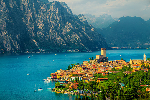 Fantastic summer vacation place, beautiful Malcesine mediterranean cityscape with colorful buildings view from the hill, lake Garda, Italy, Europe