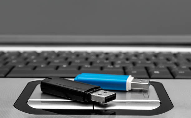 istock Flash drives on the laptop keyboard. 1222528076