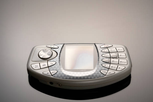 istock An outdated mobile phone with a screen for copying space on a gray gradient background. The minimalist trend. smartphone. with copy space for text 1222529032