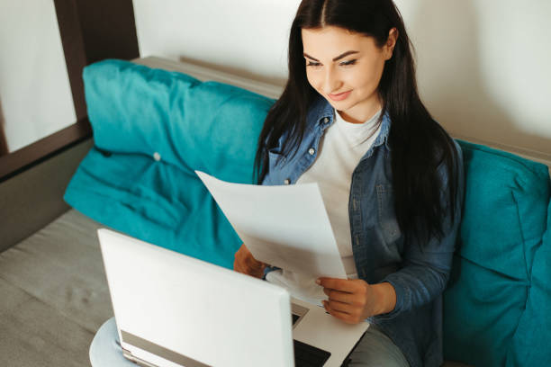 istock Young woman working from home online using laptop 1222530478