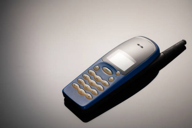 istock An outdated mobile phone with a screen for copying space on a gray gradient background. The minimalist trend. smartphone. with copy space for text 1222531940
