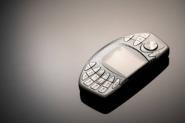 istock An outdated mobile phone with a screen for copying space on a gray gradient background. The minimalist trend. smartphone. with copy space for text 1222531995