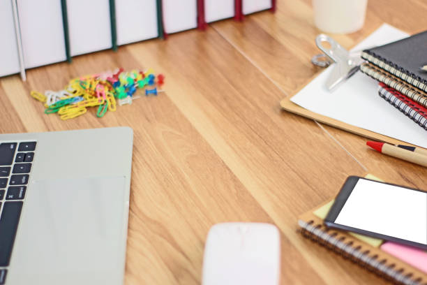 istock Workspace with mobile phone and office equipments on wood desk work background 1222532138
