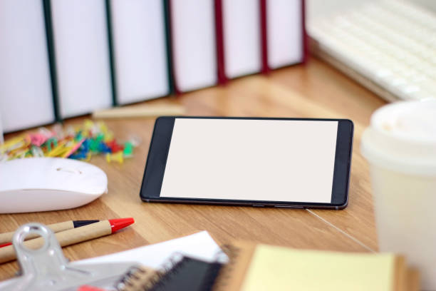 istock Workspace with smartphone and office equipments on wood desk work background 1222532144