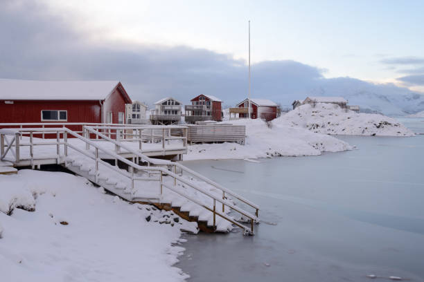 Arctic landscape of Sommaroy, Tromso municipality, Nordland, Norway Winter landscape with snow, sea, on the island of Somaroy, Arctic Ocean coast in Nordland in northern Norway sommaroy stock pictures, royalty-free photos & images