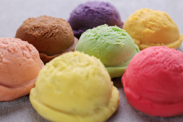 istock Ice cream scoops of different colors and flavors 1222536042
