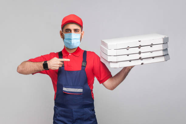 istock Delivery pizza on quarantine time for you. 1222538093