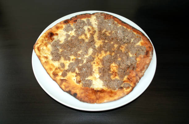 istock Mutton minced meat Manakeesh on dark wooden background. 1222539185