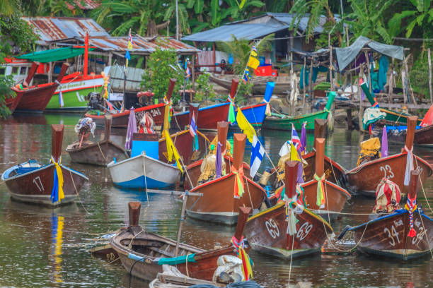 istock Typical Thai fishing boats in small harbor 1222540848