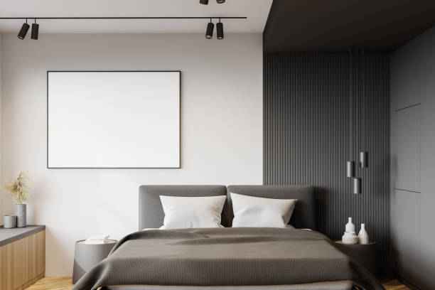 istock White and gray bedroom interior with poster 1222540954