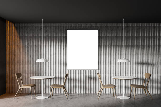 istock Round tables and poster in loft restaurant 1222541039