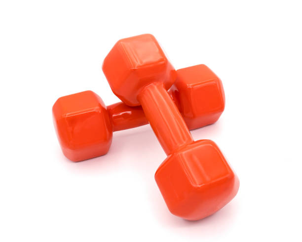 istock A pair of orange dumbbell isolated on white 1222542204