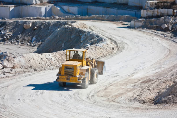 istock Yellow wheel tractor loader in a marble quarry 1222545268