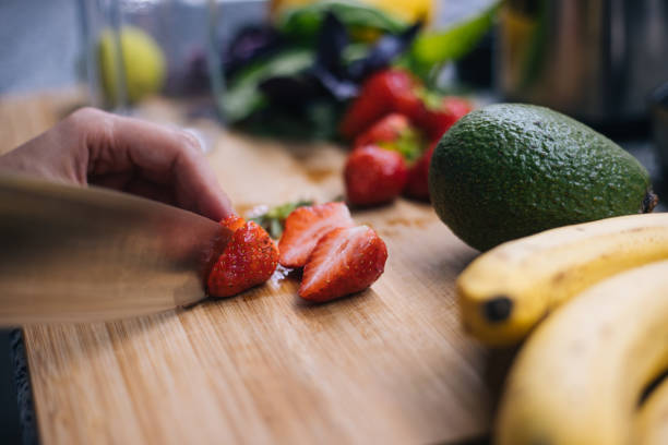 istock Woman making smoothie in kitchen 1222546158