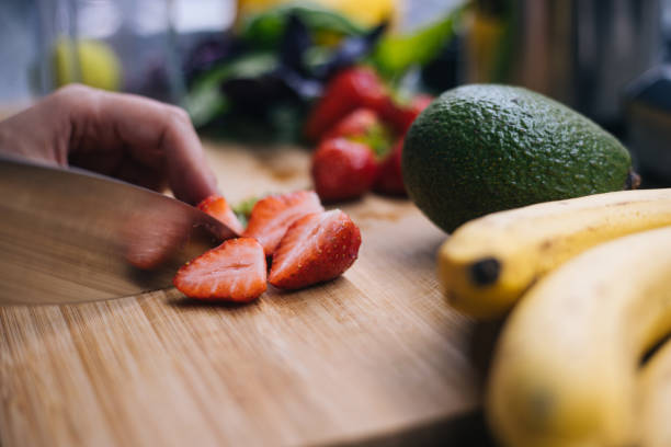 istock Woman making smoothie in kitchen 1222546215