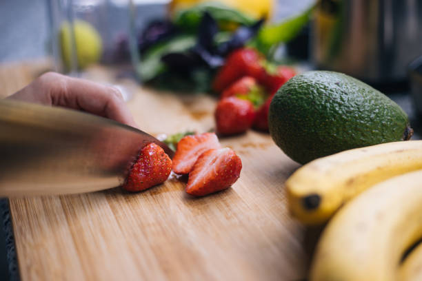 istock Woman making smoothie in kitchen 1222546228