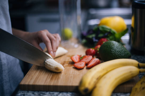 istock Woman making smoothie in kitchen 1222546231