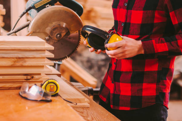 istock Skille man carpenter with protective workwear at sawmill workplace 1222547420