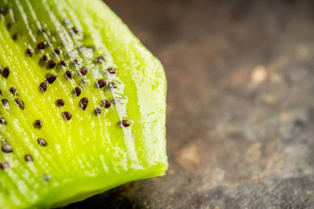 istock Fresh and ripe sliced kiwi on the rustic background 1222547929
