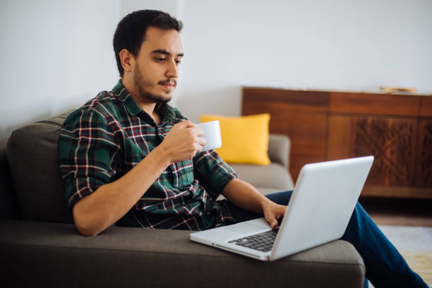 istock Young man working in his home office 1222547943