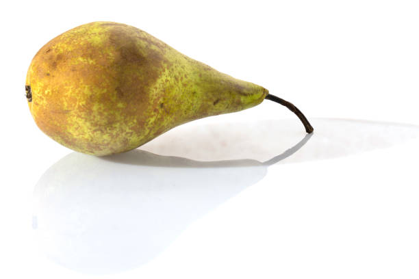 istock fresh green pear on an isolated white background with reflection 1222548890