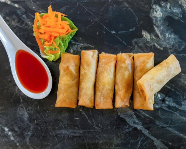 istock Crispy Vegetarian Spring Rolls on Granite Tray with Sweet Chilli Sauce 1222550615