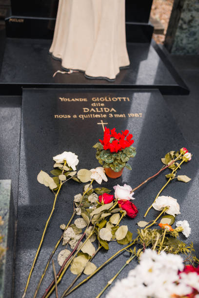 paris, france - january 13, 2020: flowers on the grave of dalida at the cemetery of montmartre - cemetery montmartre paris france france imagens e fotografias de stock