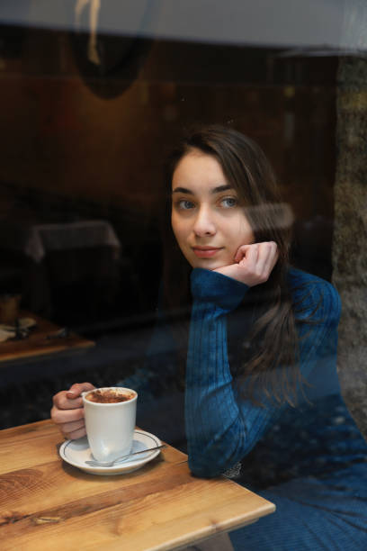istock Young woman drinking coffee 1222555406