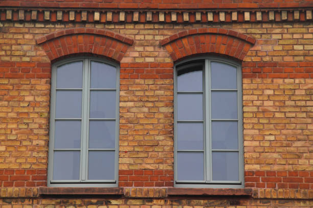 Two windows Two windows with sprouts, in a clinker wall gebäude stock pictures, royalty-free photos & images