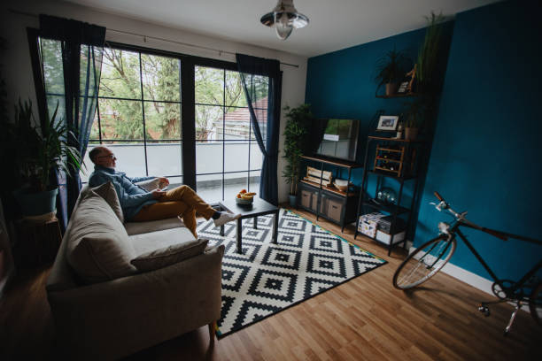 istock Senior man watching TV at home 1222559529