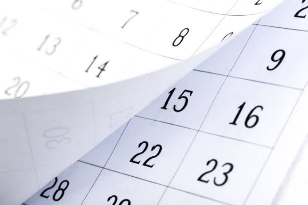 istock Closes a calendar page in blue. flipping calendar 1222561675