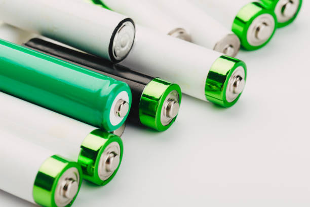 istock many new and used alkaline batteries type AA on a light background. 1222561917
