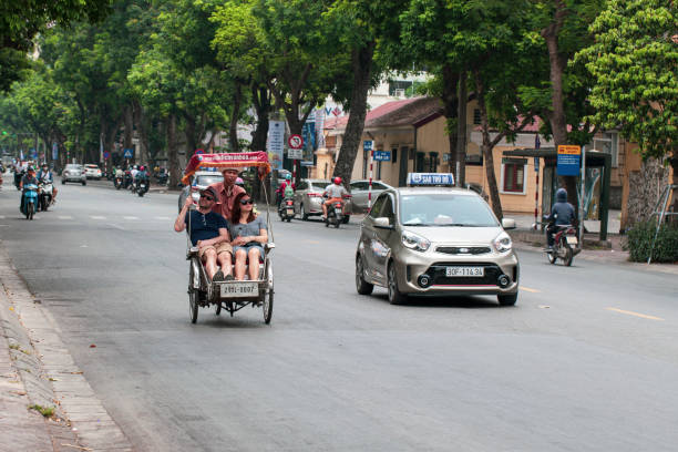 The Old Quarter, The Hanoi Street, rickshaw in the streets of Vietnam Hanoi, Vietnam - june 11, 2019: The Old Quarter, The Hanoi Street, rickshaw in the streets of Vietnam vietnamese man taxi motorbike driver stock pictures, royalty-free photos & images