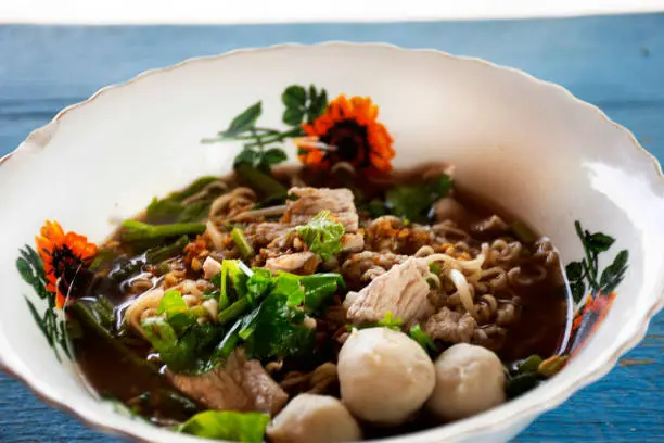 Photo of Instant noodles black blood soup or boat noodles or kuaitiao ruea with meat vegetable thai style
