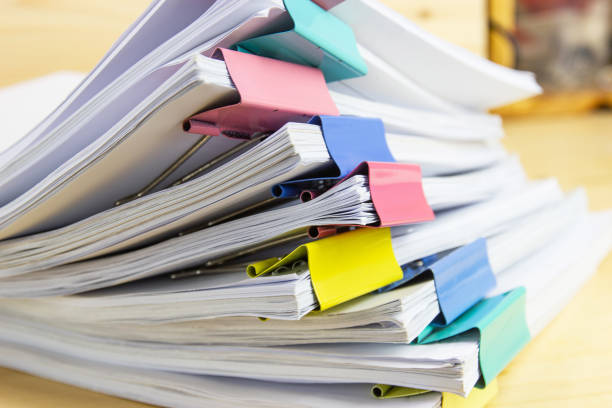 istock pile of papers at work office for business on the table, concept document in work office 1222564578