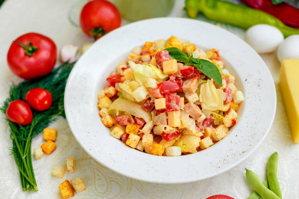 istock fresh salad with chicken, cheese, rusks, lettuce and tomatoes 1222565947