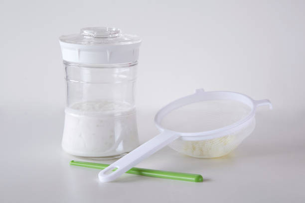 istock Milk kefir set with glass jar, plastic strainer and a stirring stick 1222567301