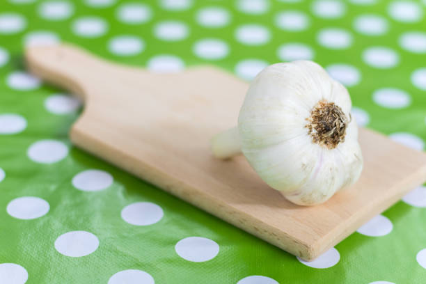 Garlic clove on the wooden board