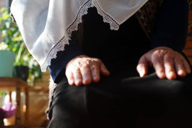 istock Senior woman praying 1222570739