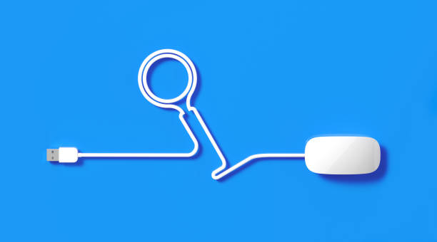 istock White Mouse Cable Forming a Magnifier Symbol On Blue Background 1222572274